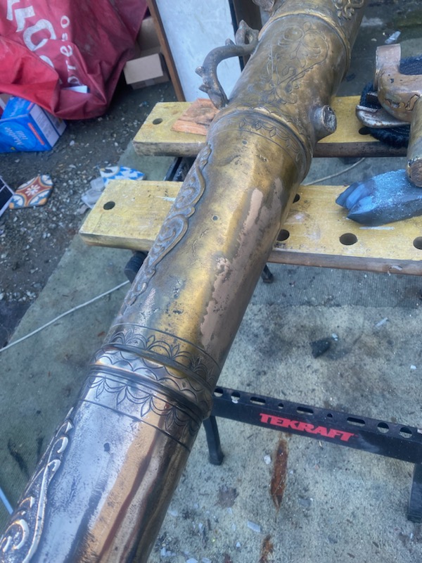 Ornate brass detail being restored